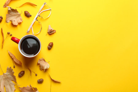 Flat lay composition with hot drink on yellow background, space for text. Cozy autumnの写真素材