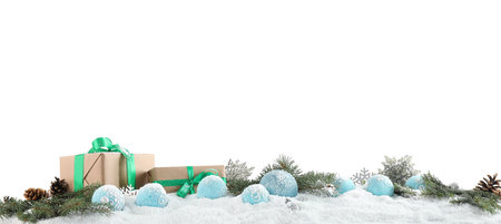 Fir branches, Christmas decoration and snow against white background