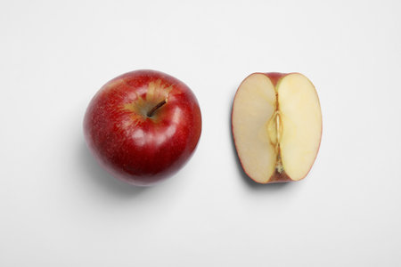 Ripe juicy red apples on white background, top viewの写真素材