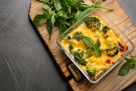 Tasty broccoli casserole in baking dish on gray table, top viewの写真素材