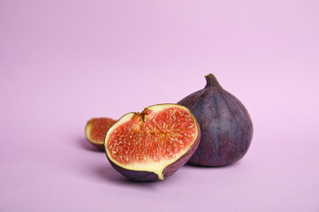 Tasty fresh fig fruit on violet backgroundの写真素材