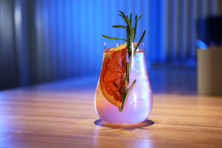 Glass of delicious cocktail with vodka on wooden counter in barの写真素材