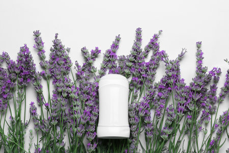 Female deodorant and lavender flowers on white background, top viewの写真素材