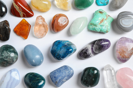 Different beautiful gemstones on white background, top viewの写真素材