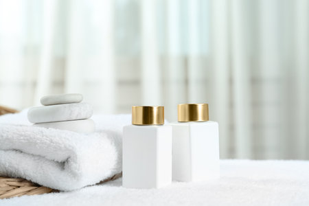 Composition with cosmetic products on white towel indoors, space for text. spa therapyの写真素材
