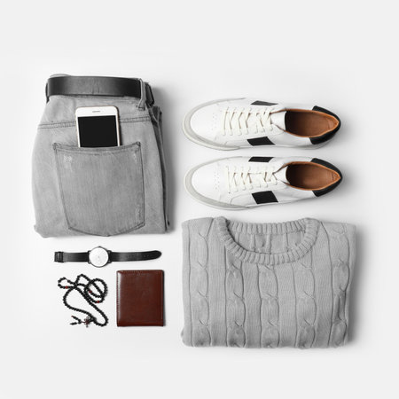 Stylish male autumn outfit and accessories on white background, flat lay. trendy warm clothesの写真素材