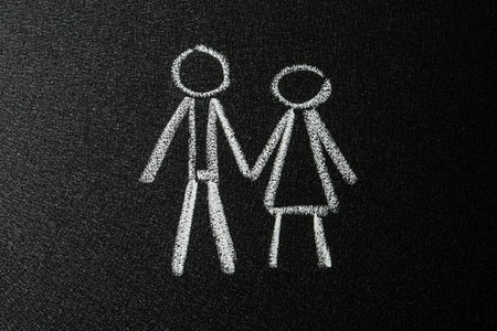 Figures of man and woman drawn on blackboard. sex educationの写真素材