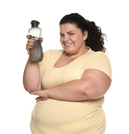 Overweight woman with bottle of water on white backgroundの写真素材