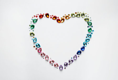 Frame made of different beautiful gemstones on white background, top view. Space for textの写真素材