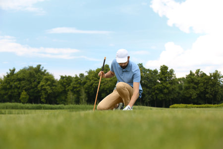 Man playing golf course. Sport and leisureの写真素材