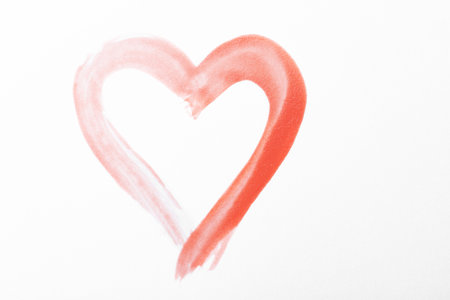 Pink heart drawn on white paper, top view