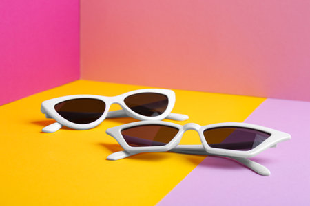 Stylish sunglasses on color background. summer timeの写真素材