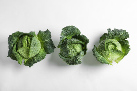 Fresh savoy cabbages on white background, top viewの写真素材