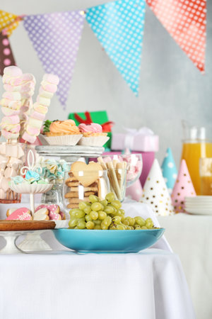 Candy bar with delicious treats for birthday partyの写真素材