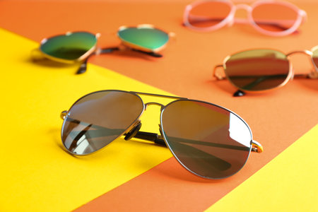 Stylish sunglasses on color background. summer timeの写真素材