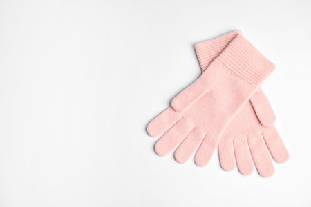 Stylish pink gloves on white background, top view with space for text. autumn clothesの写真素材