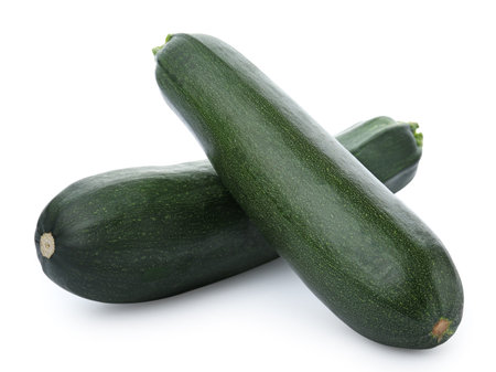 Fresh ripe green zucchinis on white backgroundの写真素材