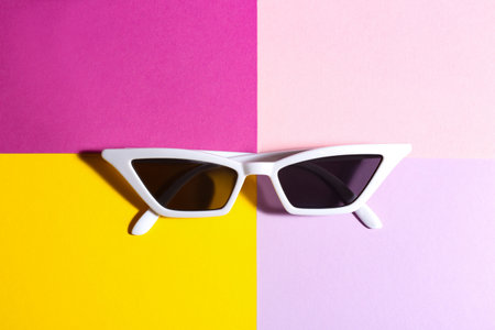 Stylish sunglasses on color background, top view. summer timeの写真素材