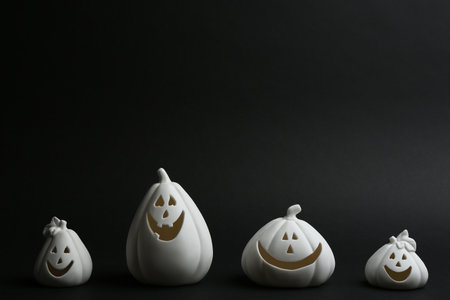 Jack-o-Lantern candle holders on black background. halloween decorの写真素材