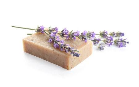Hand made soap bar with lavender flowers on white backgroundの写真素材