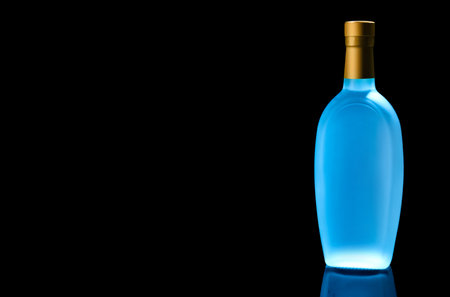 Bottle of vodka on black background. Space for textの写真素材