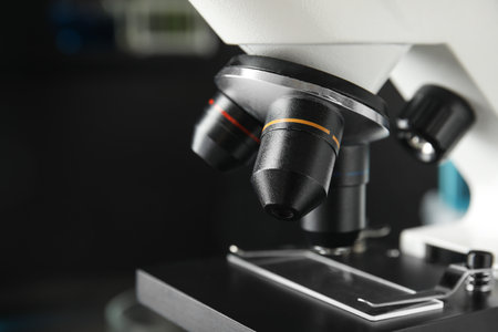 Modern microscope with different lenses in laboratory, closeup. medical equipment
