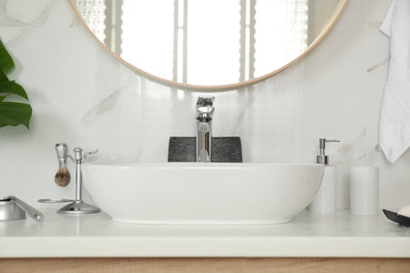 Stylish bathroom interior with vessel sink and decor elementsの写真素材