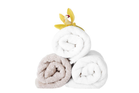 Fresh towels and exotic flower isolated on whiteの写真素材