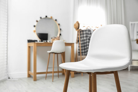 Stylish white chair in makeup room interior. Space for textの写真素材