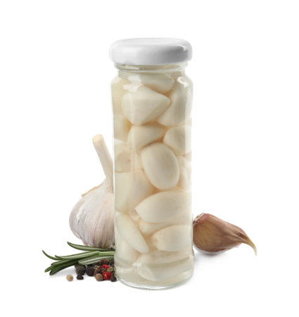 Composition with jar of pickled garlic on white backgroundの写真素材