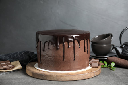 Freshly made delicious chocolate cake on gray tableの写真素材