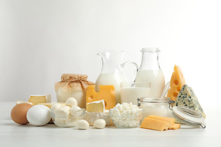 Different delicious dairy products on white tableの写真素材