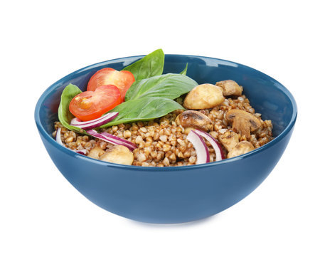 Delicious buckwheat porridge with vegetables and mushrooms on white backgroundの写真素材