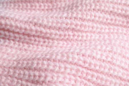 Pink knitted sweater as background, closeup viewの写真素材