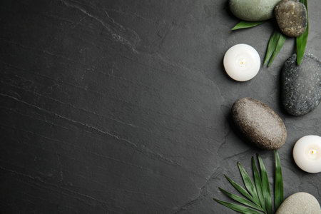 Flat lay composition with stones on black background, space for text. Zen conceptの写真素材