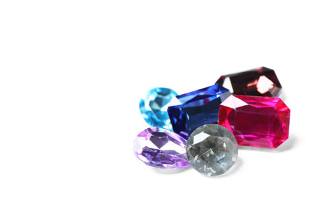 Different beautiful bright gemstones on white backgroundの写真素材