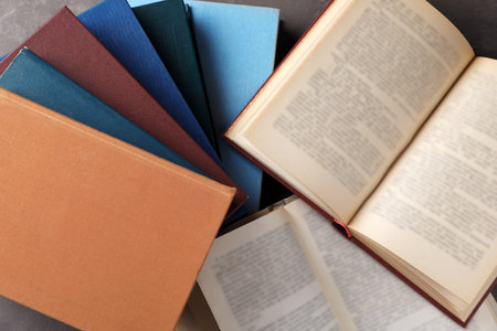 Hardcover books on gray background, top viewの写真素材