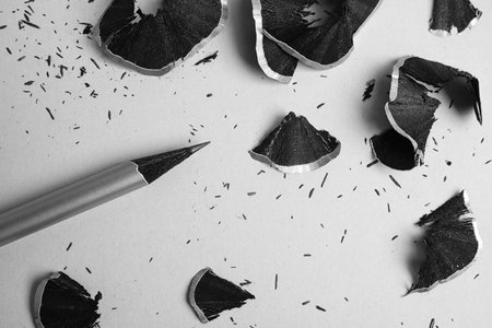 Pencil and shavings on gray background, flat layの写真素材
