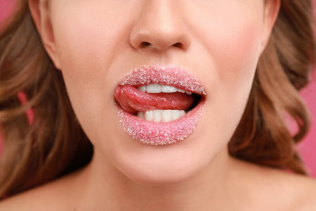 Beautiful young woman with sugar lips, closeupの写真素材