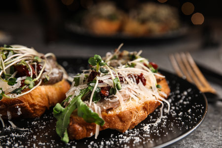 Delicious bruschettas with beef and cheese on table, closeupの写真素材