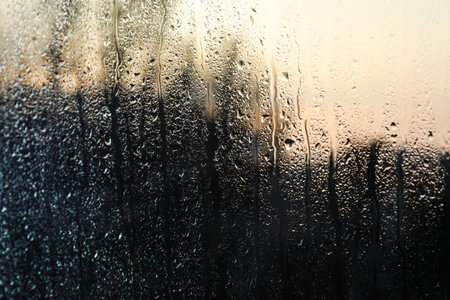 Rain drops on window glass as background, closeupの写真素材