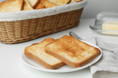 Slices of toasted bread on white tableの写真素材