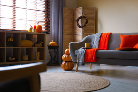 Cozy living room interior inspired by autumn colorsの写真素材