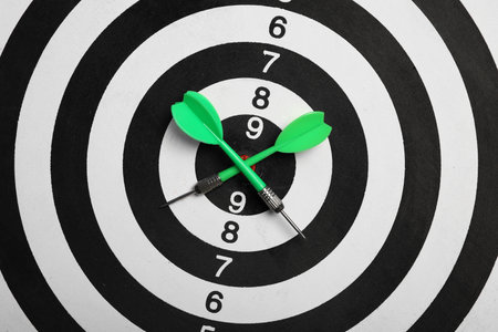 Close up of dart board with color arrows, top viewの写真素材