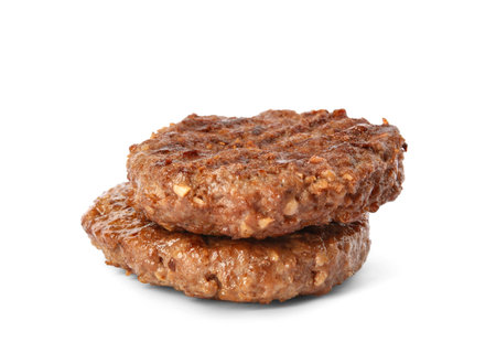 Grilled meat cutlets for burger isolated on whiteの写真素材
