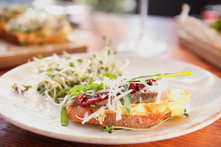 Delicious bruschettas served on wooden table, closeup