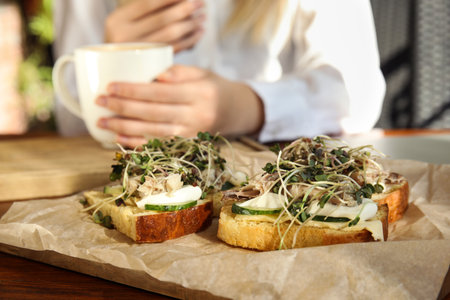 Food blogger in cafe, focus on delicious bruschettasの写真素材