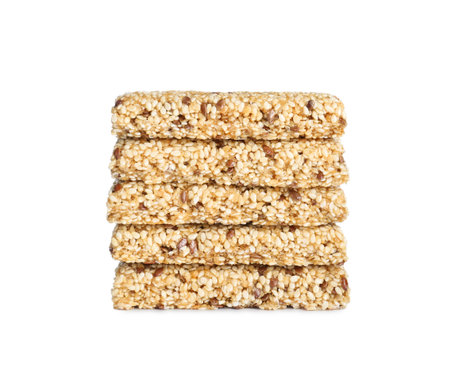 Tasty sesame seed bars isolated on whiteの写真素材