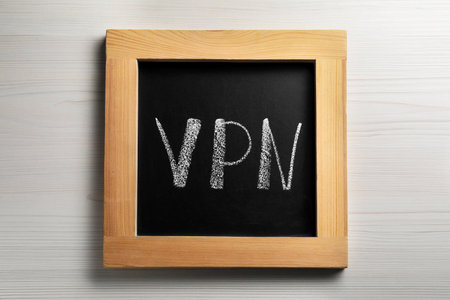 Chalkboard with VPN acronym on wooden table, top viewの写真素材