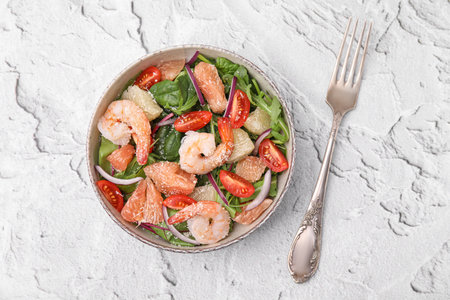 Delicious pomelo salad with shrimps served on white textured table, flat layの写真素材